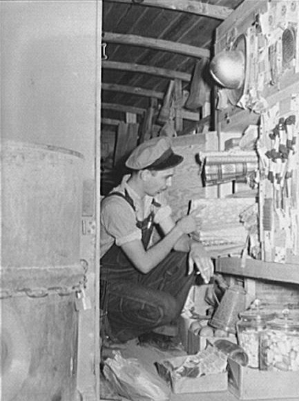  Inside of rolling store with tank of kerosene on back (at left). Coffee County, Alabama. Average daily sale is sixty dollars and they take in lots of produce