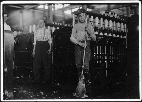 Young sweeper in Annniston Yarn Mill Nov. 1910 photo by Lewis Hines