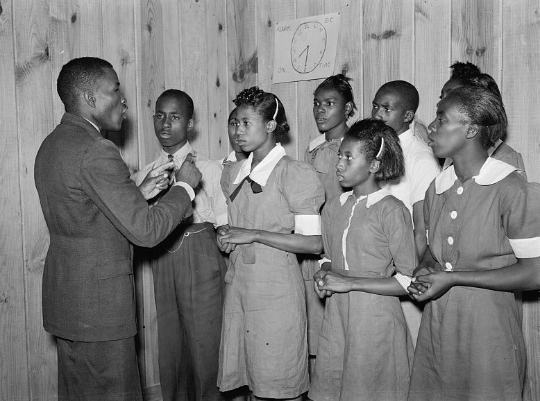 School Choir led by Robert Pierce, principal, They won state championship, photo taken by M. P. Walcott