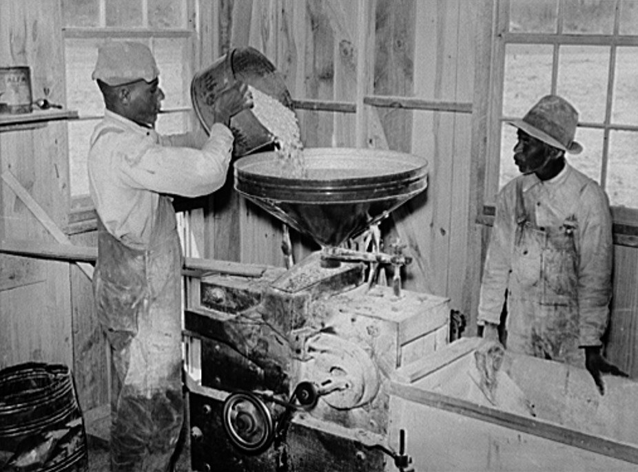 1939 Project famililes have their corn ground into meal at cooperative grist mill. Gee's Bend, Alabama