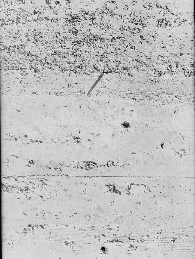 Detail of rammed earth construction near Birmingham, Alabama. Texture of wall after thirty days of weathering