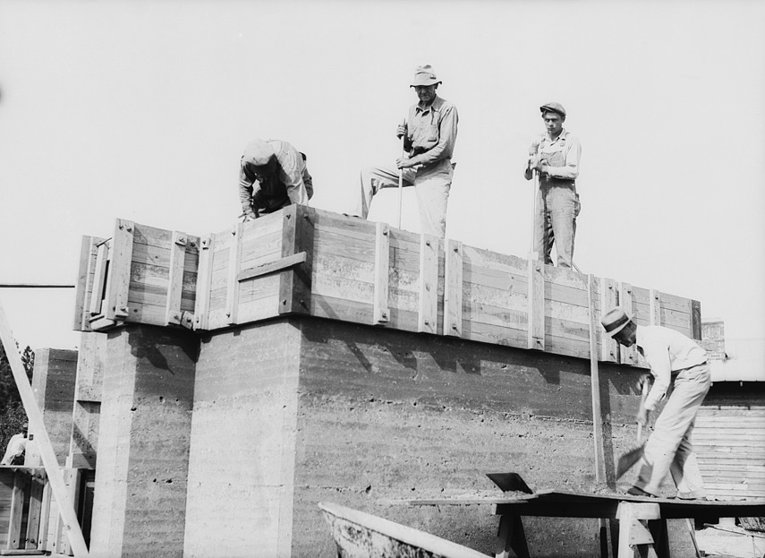 Rammed earth construction near Birmingham, Alabama. Three-inch layers are tamped in the forms until it is filled