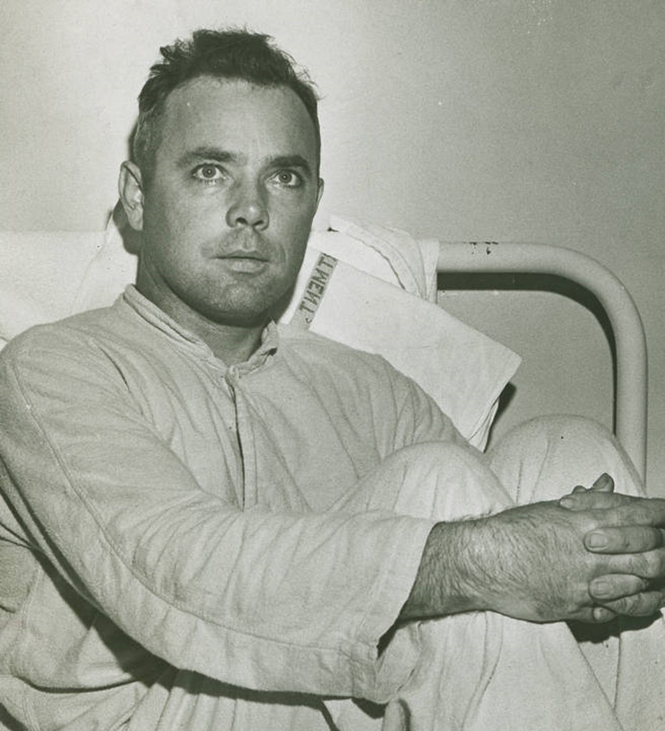 Alabama serviceman Turner, who was injured during World War II. Turner is seated on a hospital bed. He is probably a patient at Northington General Hospital in Tuscaloosa, Alabama. Q46242