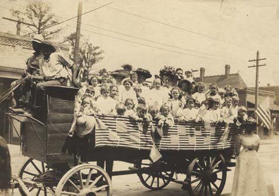 Children and adults in the back of a wagon, ready for the Annual Kindergarten Picnic in Ensley ca. 1900-1910 – . Q5517