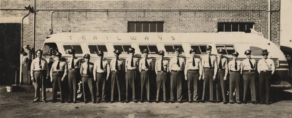 Drivers standing in front of a Trailways bus at a station, probably in Anniston, Alabama. ca. 1950-1959 by Anniston Studio, Anniston, Alabama Q55912