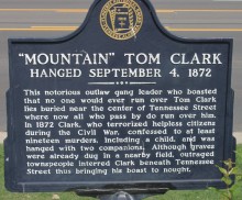 Outlaw Mountain Tom Clark is buried under Tennessee Street in Florence, Alabama