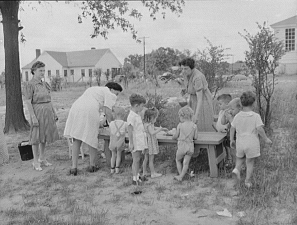 Childersburg, Alabama. Tomato juice is served to the children at 10 a.m. in the WPA day nursey for defense workers children May 1942 John Collier